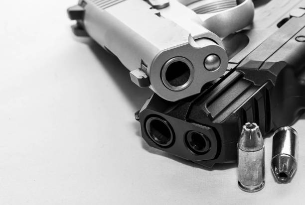 istock Two pistols along with hollow point bullets 1479067982