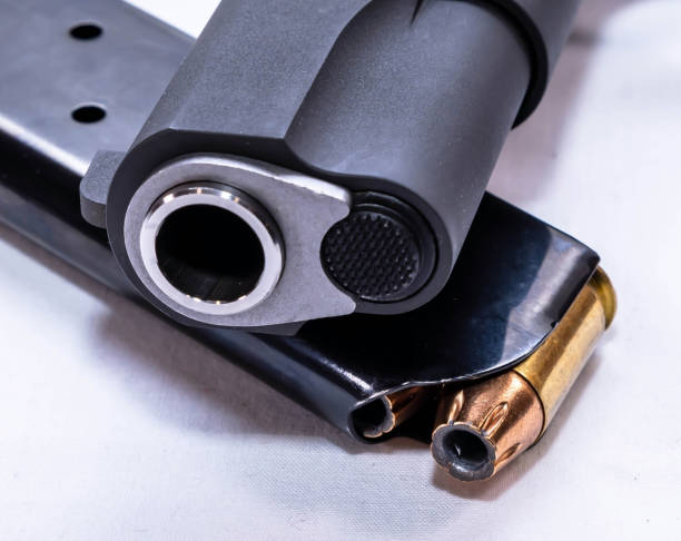 istock A loaded pistol magazine under a black pistol 1479068003
