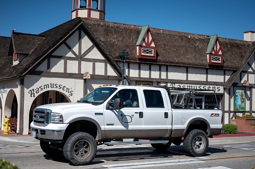 Slovang, United States – September 08, 2022: Detail of a 1999 Ford Super Duty F-Series F-250 white pickup truck