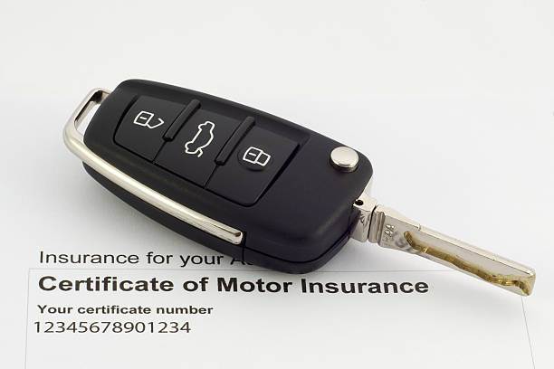 istock Motor insurance certificate and modern car key 147906951