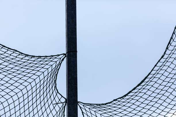 istock A rough net is tied to a pole against a blue sky. 1479069664