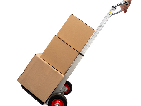 Cardboard boxes with a trolley on a white background, cardboard boxes on a wheelbarrow. delivery concept.