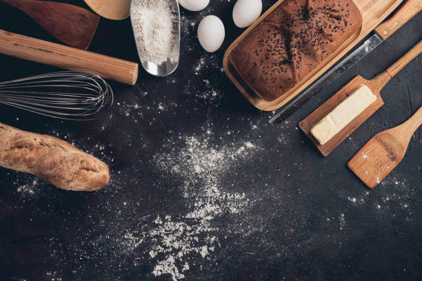 istock Top view of bakery utensils and ingredients on a black table 1479069939