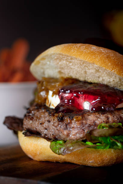 istock Vertical shot of a tasty-looking burger on a blurred background 1479072388