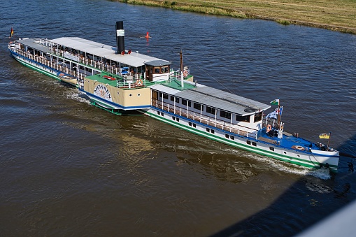 Dresden, Germany – February 07, 2022: paddle steamer on the elbe near dresden