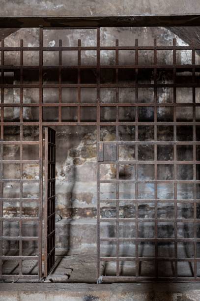 istock an old prison cell block that has bars and the door is open 1479074915