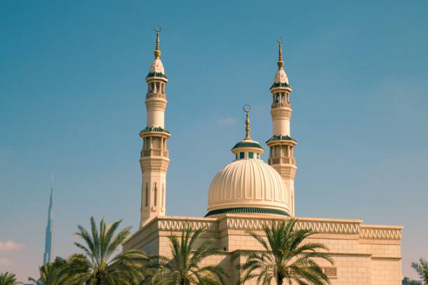 istock Jumeirah Mosque surrounded by palm trees under the sunlight in Dubai, UAE 1479076913