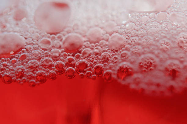 istock Macro shot of soap bubbles on red background 1479077151