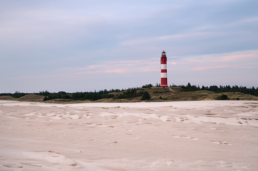 A beautiful view of the Wittduen lighthouse at sunset, Amrum, Germany