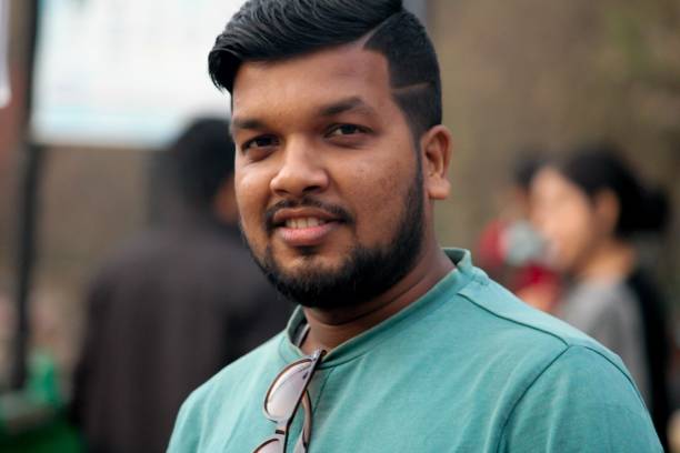 istock Indian male stands facing the camera while smiling 1479077981