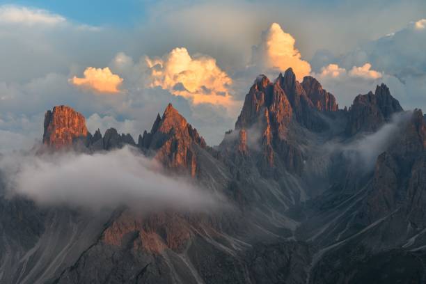 istock Stunning aerial view of a mountain range featuring jagged peaks and low-lying clouds 1479078230