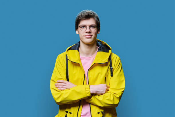 istock Handsome guy posing in outwear, on blue background 1479078714