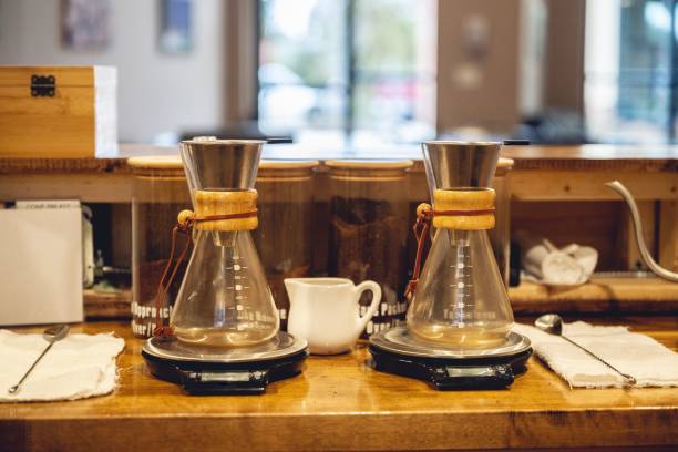 istock Closeup of two coffee brewing flasks on the scales. 1479081584