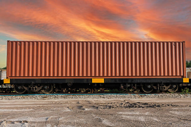 istock Train wagons carrying cargo containers for shipping companies. 1479084489