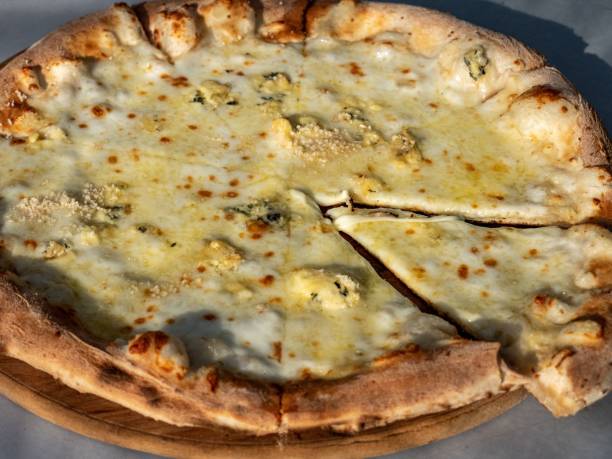istock Delicious freshly made pizza on a plate, presented on a table 1479087304