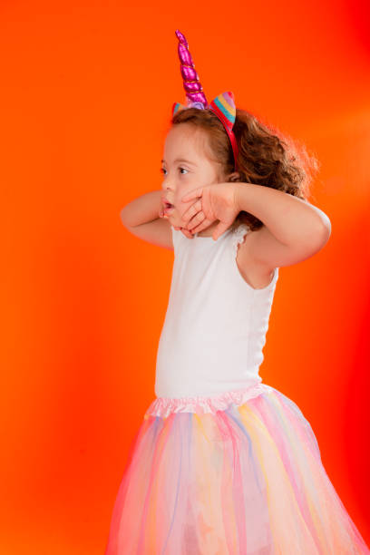 istock Cheerful beautiful girl making gestures with hands on chin. 1479087458
