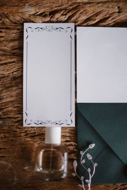 istock Vertical shot of a wedding invitation with a sealed envelope on the table 1479087783