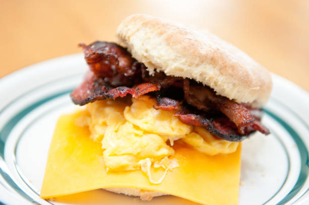 hearty egg, cristpy bacon, cheese sandwich on a homemade buttermilk biscuit