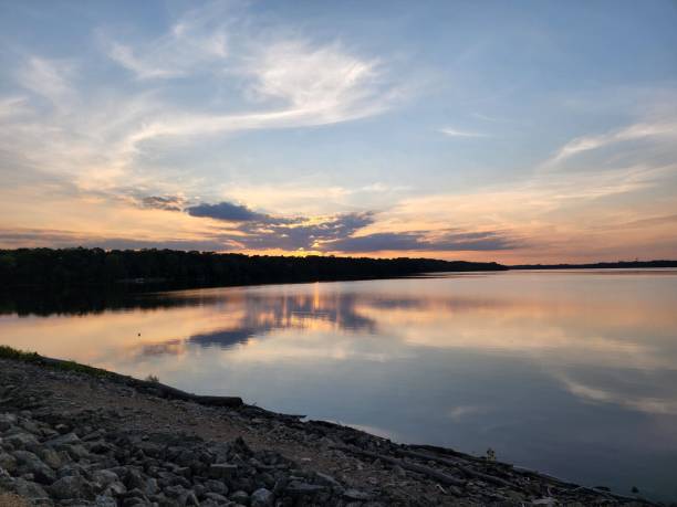 istock Beautiful warm orange sunset over the tranquil rocky shore 1479095252