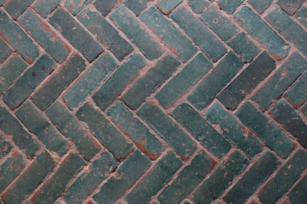 istock Closeup shot of old gray interlocking paving stones texture background 1479097849