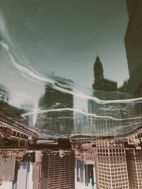 istock Vertical shot of modern high-rise buildings upside down reflection on a forzen lake surface 1479098403