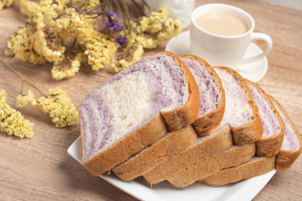 istock Sliced bread with taro and coffee on wooden background 1479098923