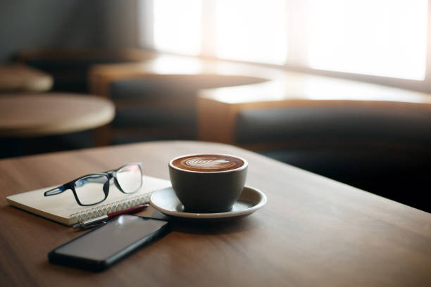 istock coffee cup on desk, business concept 1479102509
