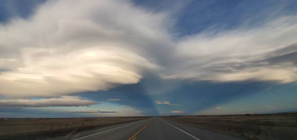 istock a cloud is rolling through the sky over the highway in front of it 1479104764