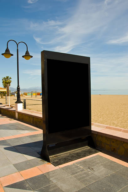 istock Vertical shot of an empty black billboard on a beach 1479105310
