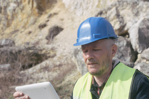 istock Inspecting rocks at stone quarry 1479107860