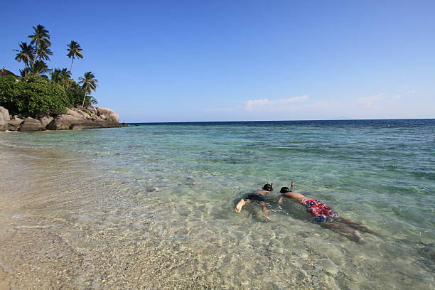 Snorkling in clear water beach