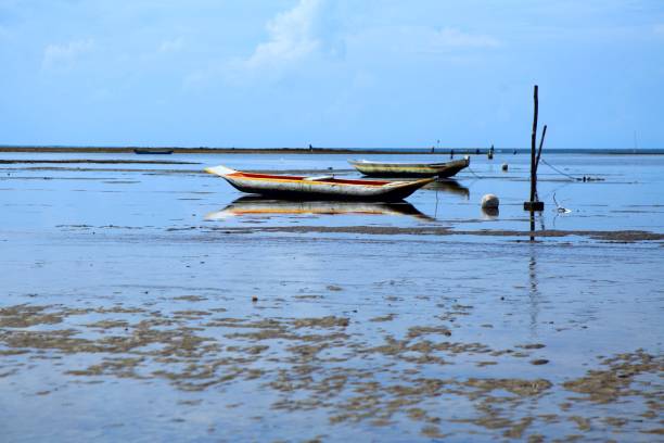 istock Colorful boat in blue water. Beach at low tide 1479108199