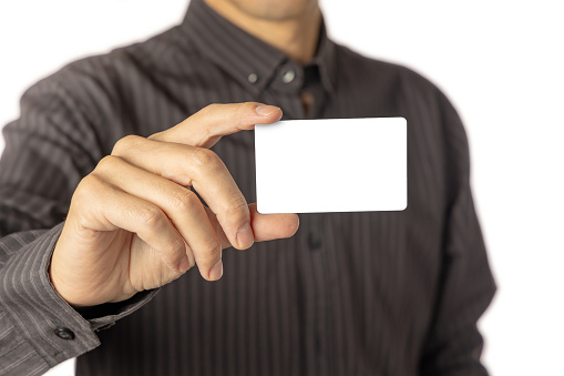Close up of a man holding a blank card.