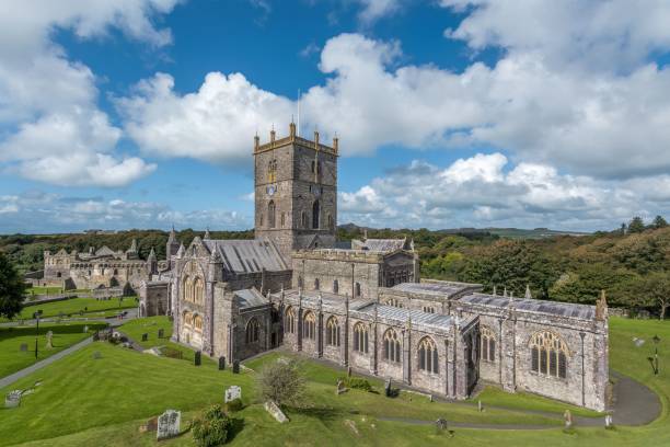 istock St Davids Cathedral on the lush green grass in Wales. 1479110757