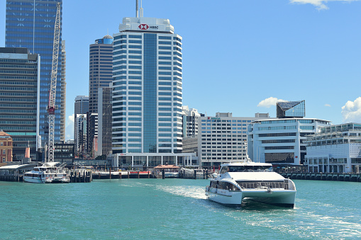 Auckland, New Zealand – January 05, 2021: View of Fullers catamaran ferry leaving Auckland downtown terminal