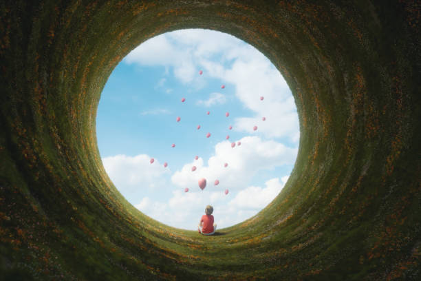 jeune garçon assis dans un paysage fantastique - nature summer child one little boy photos et images de collection