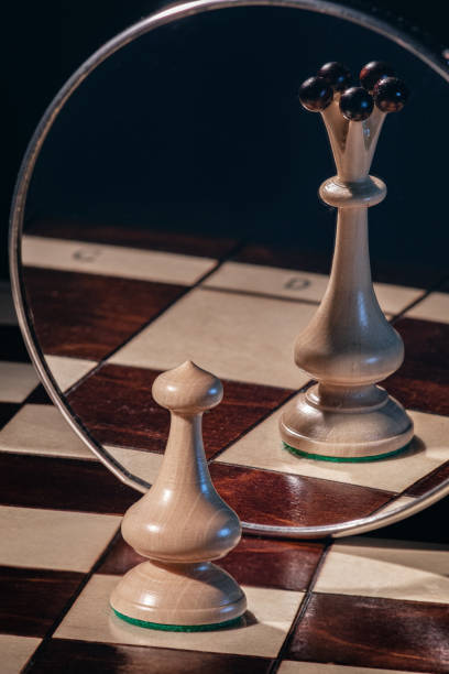 istock Chess pieces in mirror reflection. secret desire idea 1479121640