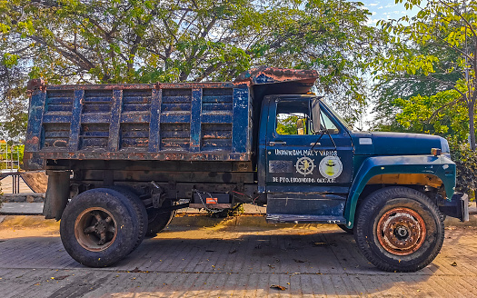 Puerto Escondido Oaxaca Mexico 27. January 2023 Various Mexican dump tipper truck trucks dumper cargo transporter delivery cars in Puerto Escondido Zicatela Oaxaca Mexico.