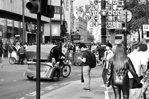 London, England 20 August 2021: Green Eco friendly, sustainable methods of travelling around central London.  Walk or cycle and even hire a guy with a cycle rickshaw to take you where you need to go.