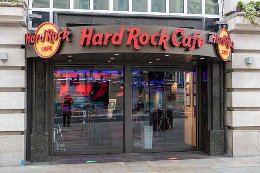 London. UK- 05.03.2021. The branch of Hard Rock Cafe in London Leicester Square showing the company signage on the facade.