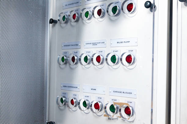 istock Dashboard with buttons to start and stop systems in the ship's engine room. 1479129007