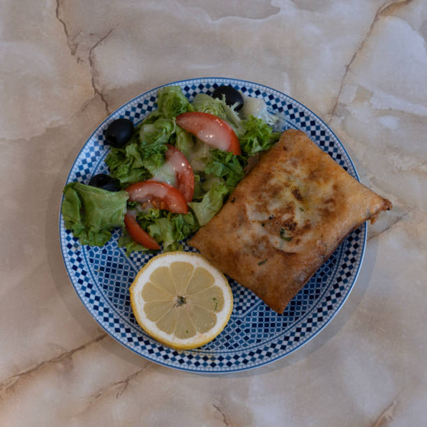 istock Paris, France - 12 09 2022: Tunisian dishe culinary Still Life. Brick salad 1479130095