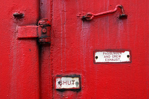 Red door on a ferry boat stock photo