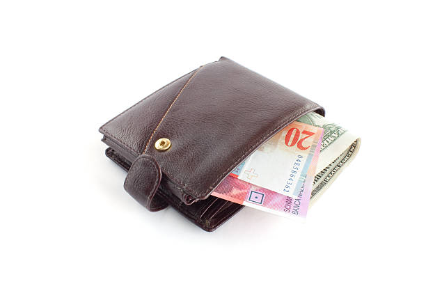 istock Brown leather wallet with money 147913069