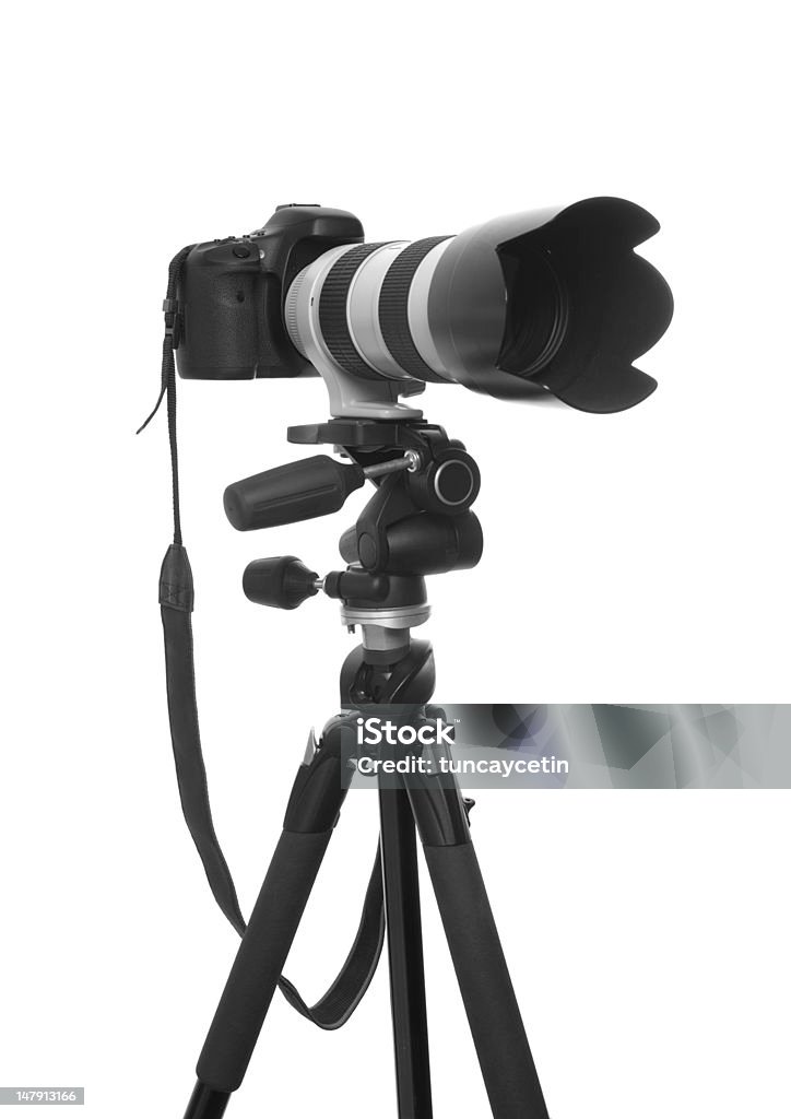 Dslr Camera on Tripod With Zoom Lens Dslr Camera on Tripod With Zoom Lens on White Background Black Color Stock Photo
