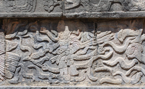 istock Bas-relief carving with indian warrior and serpents, pre-Columbian Maya civilization, Chichen Itza, Yucatan, Mexico 1479135019