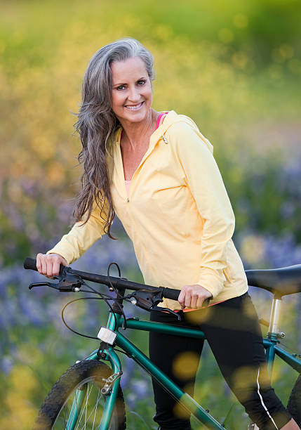 istock Middle Aged Woman Posing With Bicycle 147913503