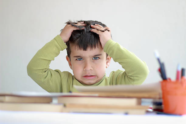 istock Little boy grabbing hair with bored expression on face 147913646