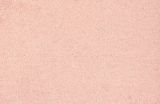 Recycled craft paper textured background in light pink old rose stock photo