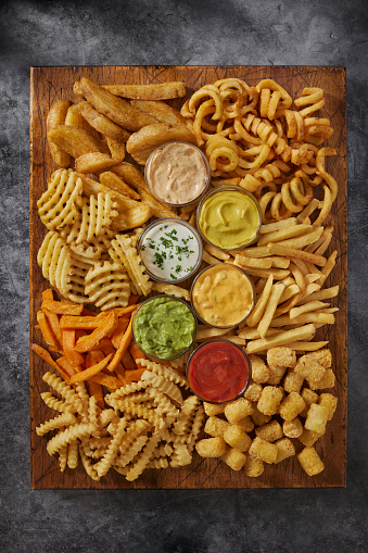 The Ultimate French Fry Board with Curly Fries, Potato Gems, Crinkle Cut, Steak Fries, Take Out Fries, Sweet Potato and Waffle Cut  Fries with Dipping Sauce's